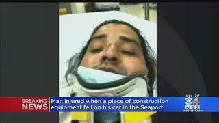 Postal worker hurt, car damaged by falling beam at Seaport construction site