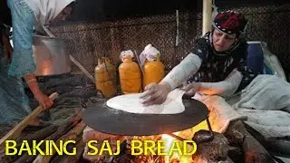 Baking traditional and local bread on the Saj of the villages of Azarbaijan, Iran
