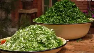 Making scallion pancakes with wild greens and oil drums.
