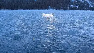 Caples Lake, CA - Drone Over Frozen Mountain Lake