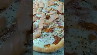 Homemade mozzarella pizza with salmon