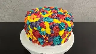 Tropical rainbow cake with a mango explosion