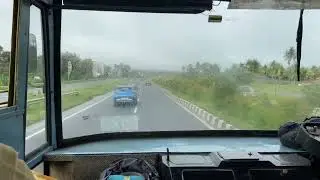 KSRTC Superfast Bus on the National highway on a rainy day