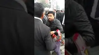 Lawyer slapped this guy on passing the blocked road on a protest day!