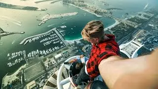 Russian guys on the roof top in Dubai. Princess Tower .414 m (1,356 ft)