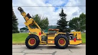GLADIATOR SCALPINE WITH BUCKET IN OPERATION