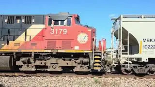 CN 2779, 3179 Westbound train with AOKX CARBO hopper, Canadian Pacific box car at Vicksburg, MI