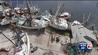 Cranes help recover beached boats in Fort Myers due to Hurricane Ian's impact