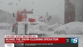 What goes on behind the snow-clearing operation during blizzard conditions in Marquette County