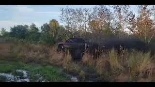 chevy mud truck going through swamp on 54in boggers in 2wd with texas speed ls 383 stroker