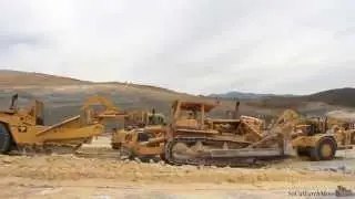 CAT D9G ripping for herd of 657E 's