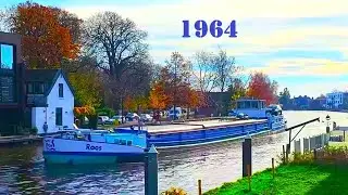 Roos 1964. Vintage Working barge passes through the Dutch Bridge. River Ship