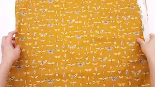 mustard brown Stof France fabric with butterfly and insect motif