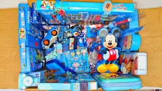 Box full of blue stationery - robot watch, pencil box, Doraemon pen, pencil sharpner, key chain etc