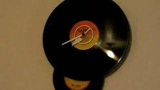 VinylTech Powderkeg Swinger -- Swinging Pendulum Vinyl wall clock