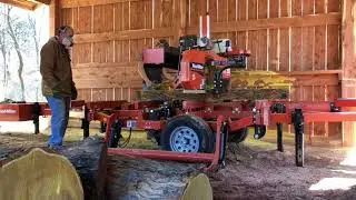 Father Son team mill Osage Orange logs on the Woodmizer