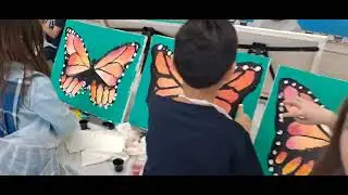 Our Lady of Perpetual Help first grade painting the Big Butterfly