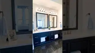Contemporary Bathroom Design with Black Cabinets and Light Blue Accents - Model Home Tour