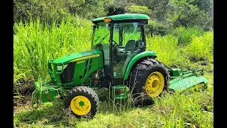 Massive Grass Growth taken care of with the John Deere 4066R