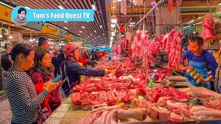 Large morning market in Shenzhen, China: fresh vegetables and meat, busy morning