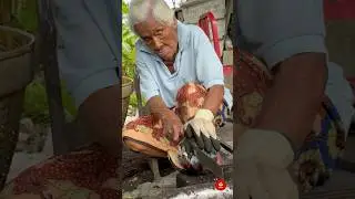 An 88-year-old Grandma cutting Smoky Roasted Coconuts with Steady Strength 🥥🔥