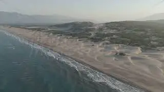 D-Log M. Gelemis, Turkey. Aerial morning view of Patara Beach coastline, Mediterranean Sea waves ...