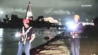 Vehicle crashes down freeway embankment and lands in the Santa Ana River 