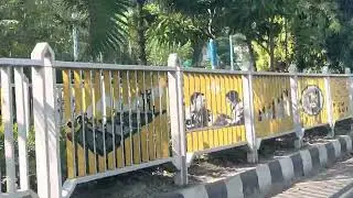 painting on a street fence Can be seen from a specific vantage point