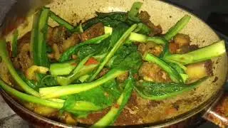 Pork curry with green mustard leaf Nepali cuisine