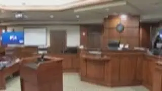 Judge delays case against Mich. suspect's parents