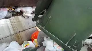 Dirty diapers getting squahed in garbage truck