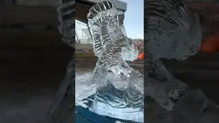 Awesome Ice Carving - Swooping owl at teddy bear