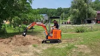 GroundHog Equipment KH23G with Tilting Bucket in Action