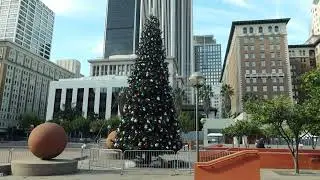 Walk around Pershing Square ice skating rink and parking garage in Downtown LA