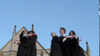 graduation caps thrown in the air LPBLVRF