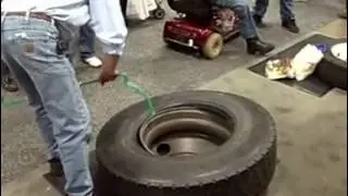 Using Ken-Tool's Serpent bar to demount an 11R22.5 truck tire at MATS 2010 in Louisville.