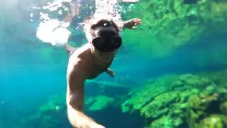 Paul Stoeppelwerth swimming in a natural cenote in Mexico.
