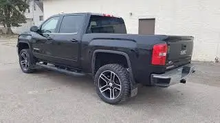 GMC SIERRA LEVELED ON 33/12.50/R22 AMP TRAIL GRIPPER