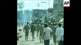 SYND 12-9-72 RIOT POLICE WITH TEAR GAS DISPERSE 'UNTOUCHABLE' RIOTERS