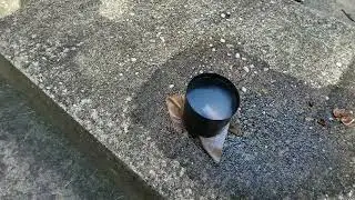 Cigarette dropped into a cup of gasoline