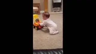 Baby owned by toy truck