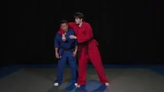 Rock Self Defense - Defense of a head lock (a) (front view)