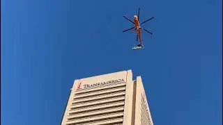 Skycrane lift of rooftop chillers at 100 Light Street in Baltimore