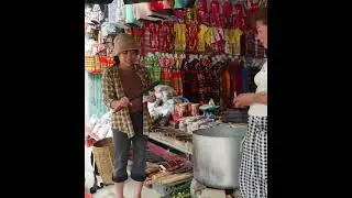 Single mother sells mountain snails at market to earn money