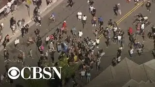 Unlawful assembly declared at California's Huntington Beach after protesters block street