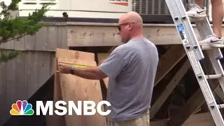 East Coast Shorelines Board Up Storefronts, Homes In Preparation For Tropical Storm Henri