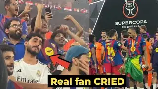 Real fan surrounded by Barca fans celebrating Supercopa