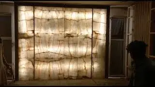 green onyx clamp fitting on wall with back light