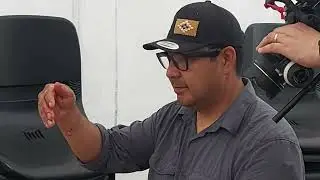 Dr. Kevin cleans a fish at K&Acirc;NIY&Acirc;SIHK - Cree Culture Camp