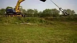 Tony Price Being swung round by a Digger